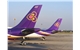 Tails_of_two_Thai_Airways_aircraft_at_VTBD