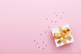 gift on pink background iStock-995571396