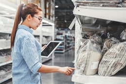 woman in warehouse iStock-1158964050