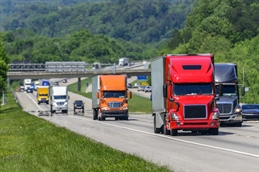TRUCKS ON HIGHWAY iStock-912235868