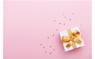 gift on pink background iStock-995571396
